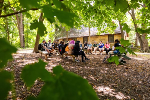 A group of honors students sit and listen to an Honors Fellow at the Honors Retreat at Lorado Taft on Aug. 22. Lorado Taft is closing their location permanently on Dec. 15. (Courtesy of Connie Storey)