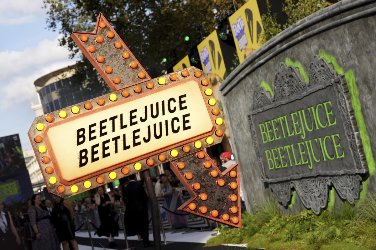 A sign reading "Beetlejuice Beetlejuice" sits at the premiere of "Beetlejuice Beetlejuice" on Aug. 29 in London. Despite releasing 36 years after the original, the sequel keeps the same charm. (Photo by Scott A Garfitt/Invision/AP)