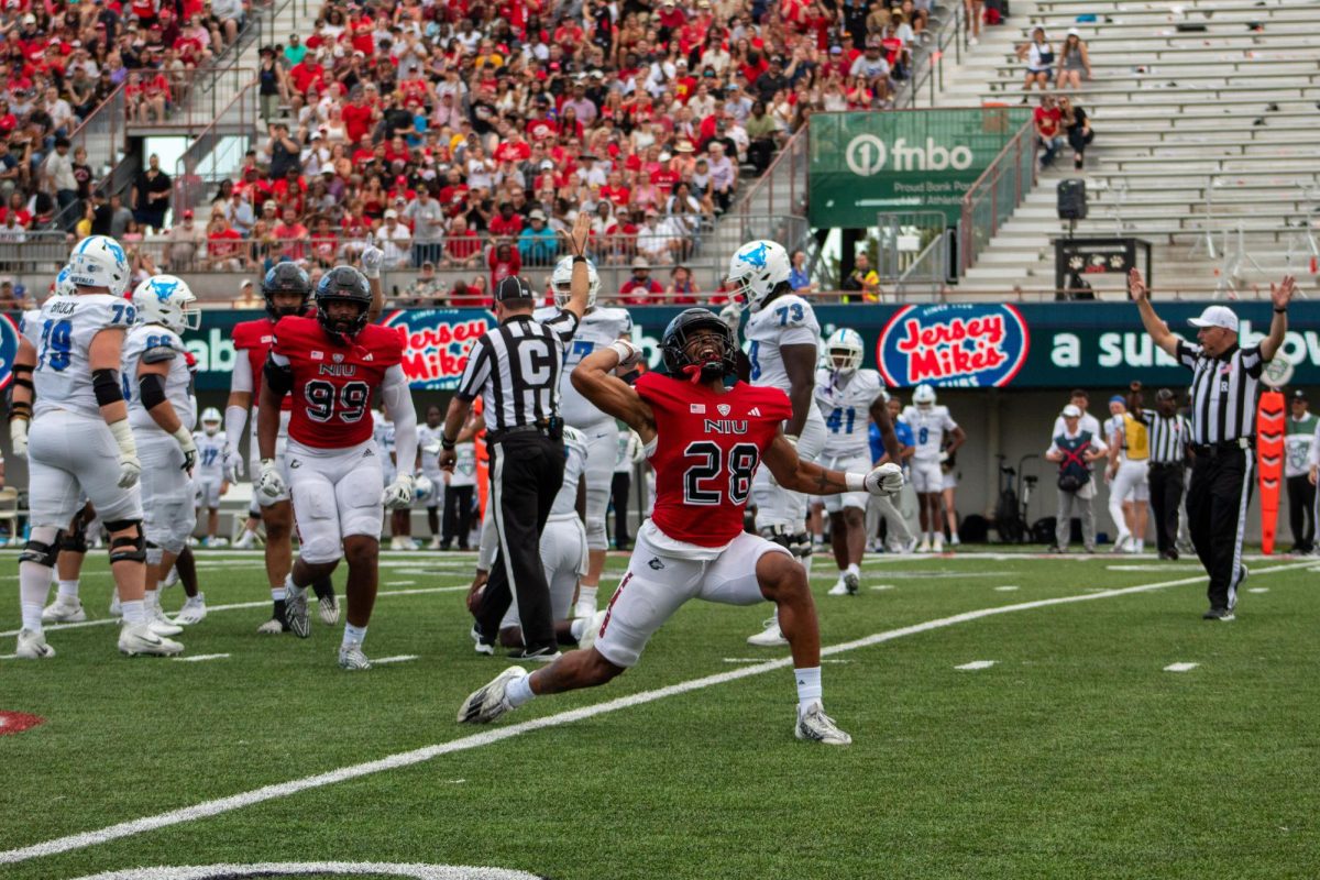 NIU junior defensive end Nevaeh Sanders (28) celebrates after sacking University at Buffalo senior quarterback C.J. Ogbonna during Saturday’s Mid-American Conference opener at Huskie Stadium. Sanders finished with three sacks, the most in a game by a Huskie since All-American Sutton Smith had four in 2018. (Totus Tuus Keely | Northern Star)