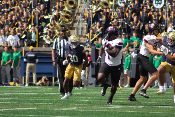 Senior running back Antario Brown (1) races to the endzone for an 83-yard touchdown reception. NIU football defeated the University of Notre Dame, who ranked No. 5 in the nation, by a score of 16-14 Saturday. (Totus Tuus Keely | Northern Star)