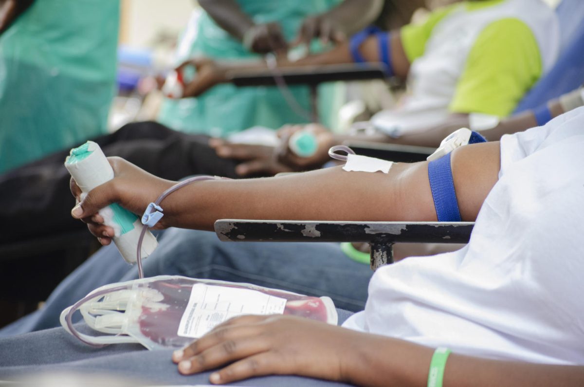 A person sits with their arm out while they're getting their blood drawn. Participants who wish to sign up to donate blood ahead of time can do so through the Red Cross website. (Getty Images)