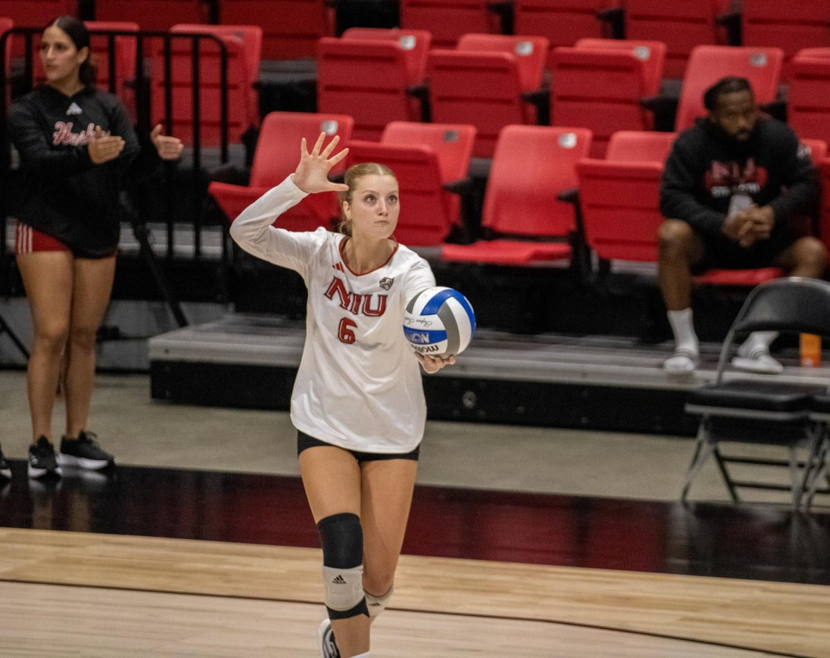 Freshman outside hitter Emma McCartney (6) gets ready to serve the ball Aug. 30 against Western Illinois University. NIU volleyball lost in five sets to Valparaiso University Thursday for its third-straight loss. (Tim Dodge | Northern Star)