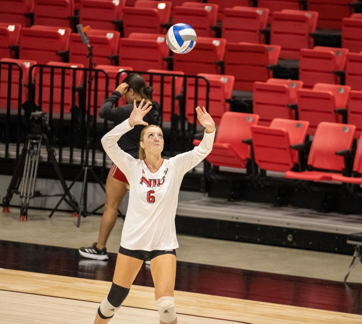 Freshman outside hitter Emma McCartney winds up for a serve on Aug. 30 against Western Illinois University. NIU volleyball defeated Stony Brook University in four sets to claim its second win of the season. (Tim Dodge | Northern Star)