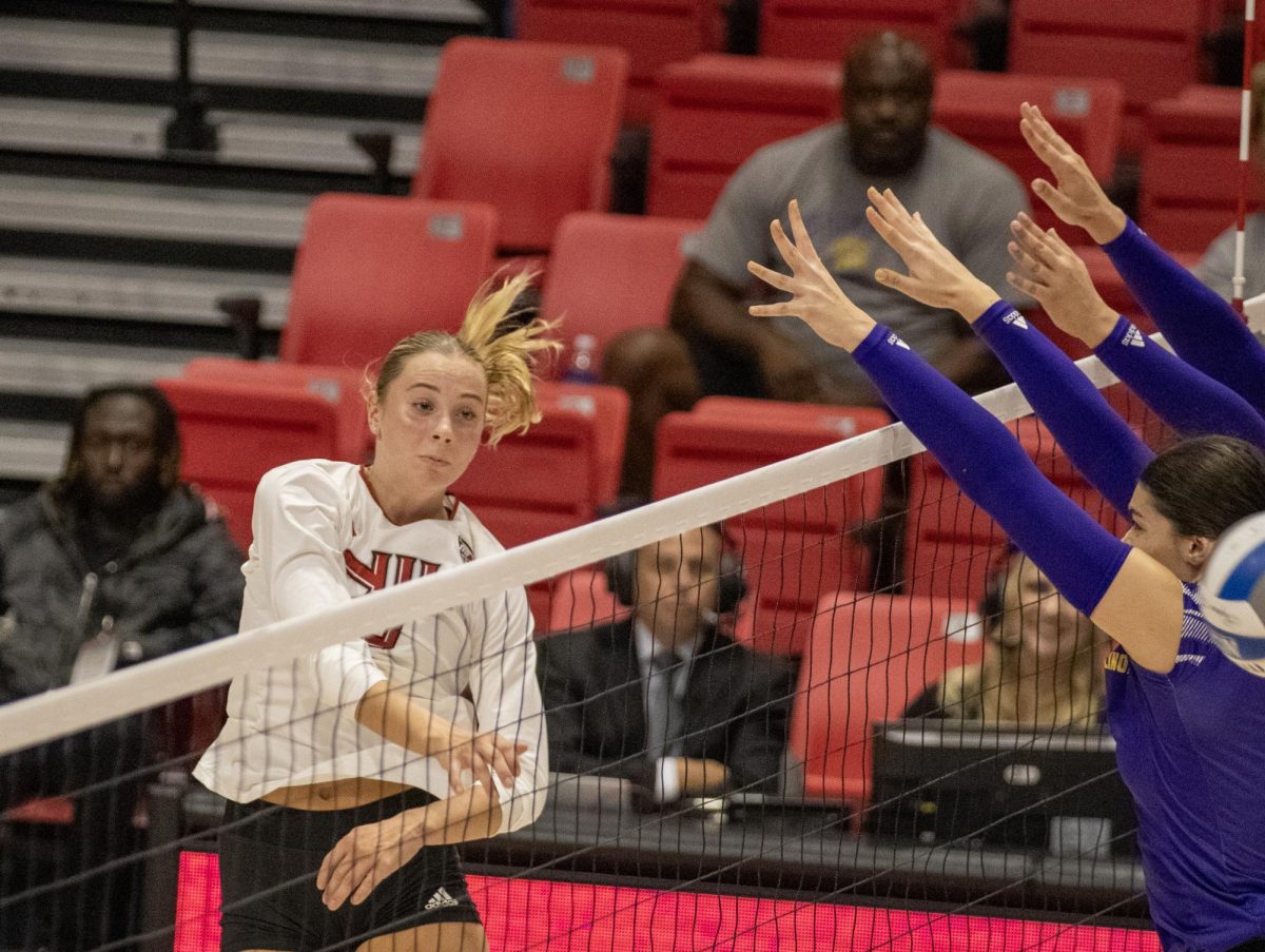 Freshman outside hitter Ava Grevengoed spikes over the net on Aug. 30 against Western Illinois University. Grevengoed recorded her fourth-straight double-double Saturday as NIU volleyball lost in four sets to the University of St. Thomas. (Tim Dodge | Northern Star)