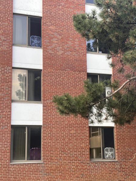 Box fans line the windows in Neptune West, one of the residence halls without air conditioning. How do you manage the sweltering heat on campus? (Lucy Atkinson| Northern Star)