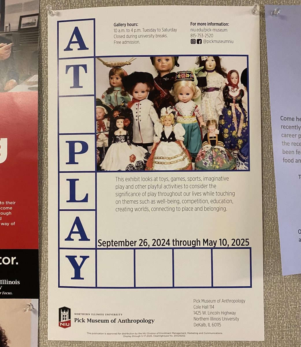 A poster for the “At Play” exhibit hangs in DuSable. This exhibit will open Thursday at the Pick Museum of Anthropology. (Brynn Krug | Northern Star)