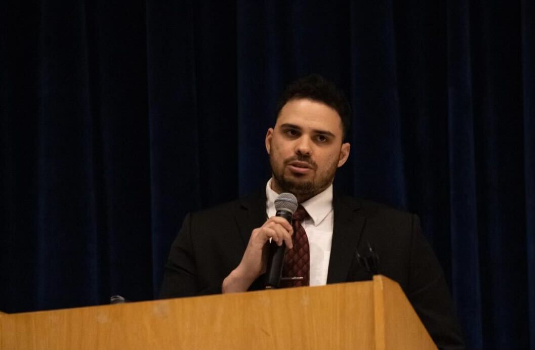 James Innis, a senior accountancy major, speaks from behind a podium. Innis is the SGA vice president for the 2024-2025 academic year. (Courtesy of James Innis)