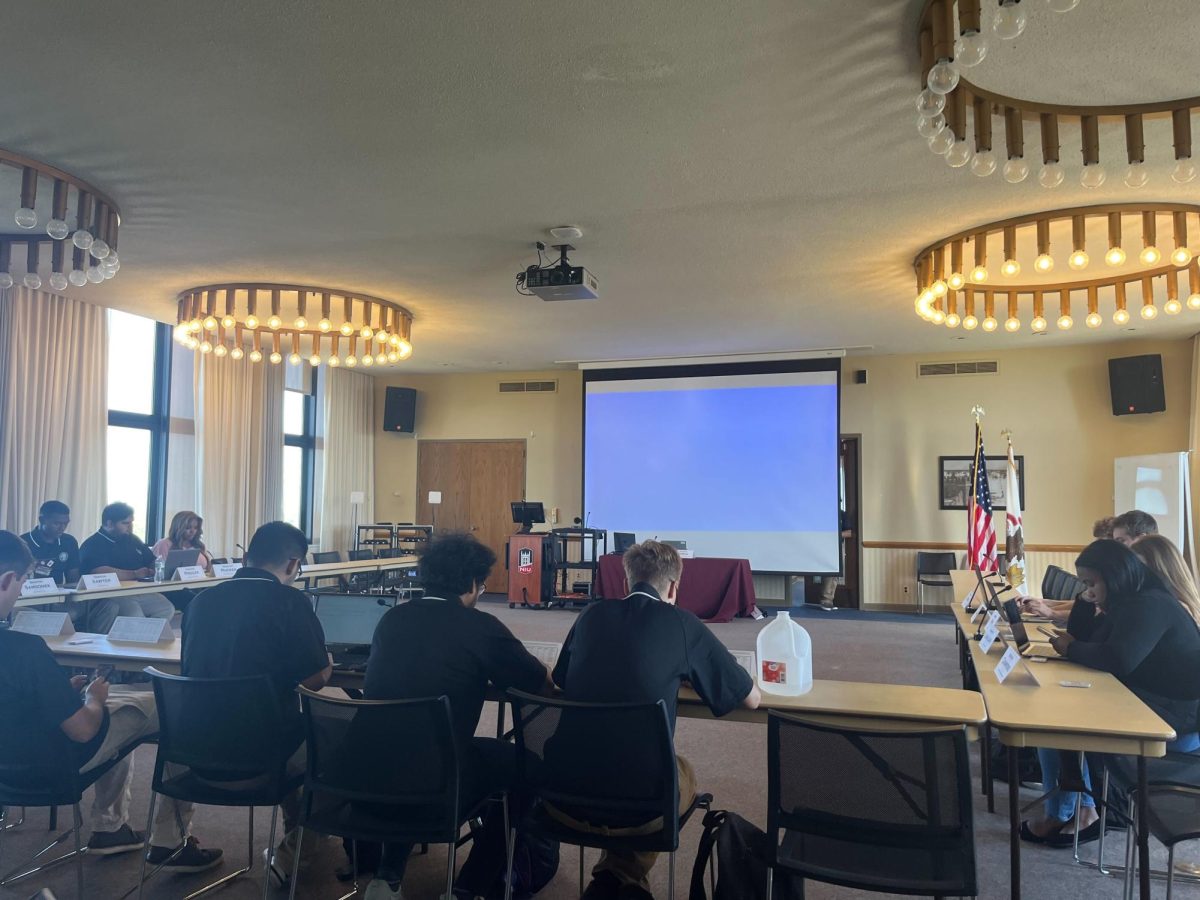 The Student Government Association senators sit in the Sky Room of the Holmes Student Center at the SGA senate meeting on Friday. The SGA voted 10-1-2 on a resolution for the SGA Supreme Court to meet and select a new chief justice. (Anna Wittenkeller | Northern Star)