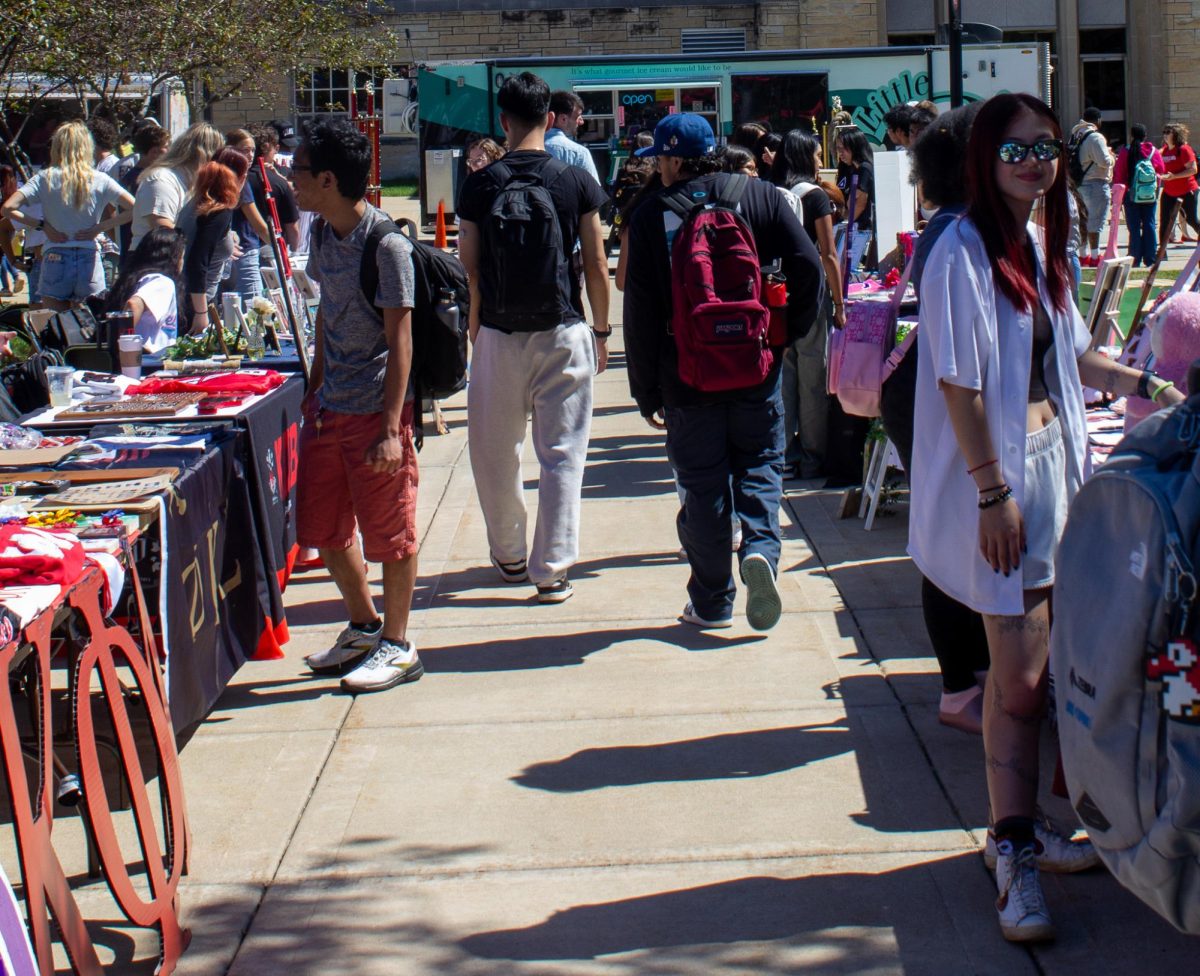 Students browse several fraternities’ and sororities’ tables Sept. 11 at the Involvement Fair. Involvement fairs are a good way to meet members of multicultural fraternities and sororities. (Ethan Rodriguez | Northern Star)