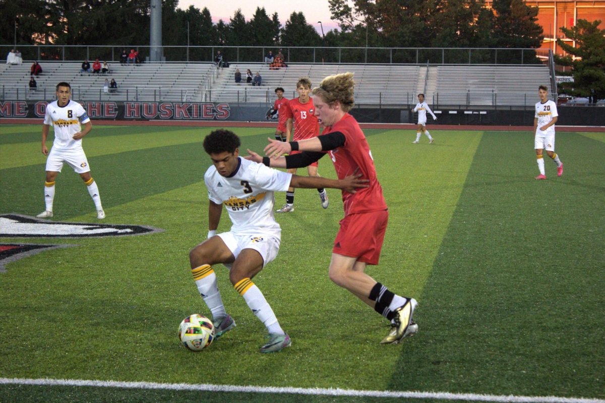 Freshman defender Tom Dahlin (right) guards University of Missouri-Kansas City sophomore defender Brevyn Cole (left) on Sept. 6 at the NIU Soccer and Track & Field Complex. NIU men's soccer was defeated by Bowling Green University 2-1 on Friday for its fourth-straight loss. (Brooke Schliephake | Northern Star)