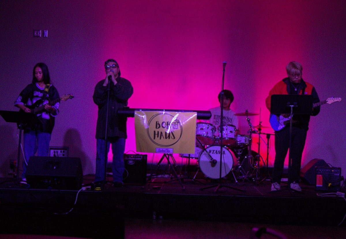 Finance major Natalie Tananal (from left), biochem major Gabriel Chanthalagsy, alumni Robin Diamzon, and psychology major Nathaniel Nguyen are seen on stage performing. Boba Haus performs a fusion of hip-hop, Rock, R&B, and Indie Rock. (Brooke Schliephake | Northern Star)