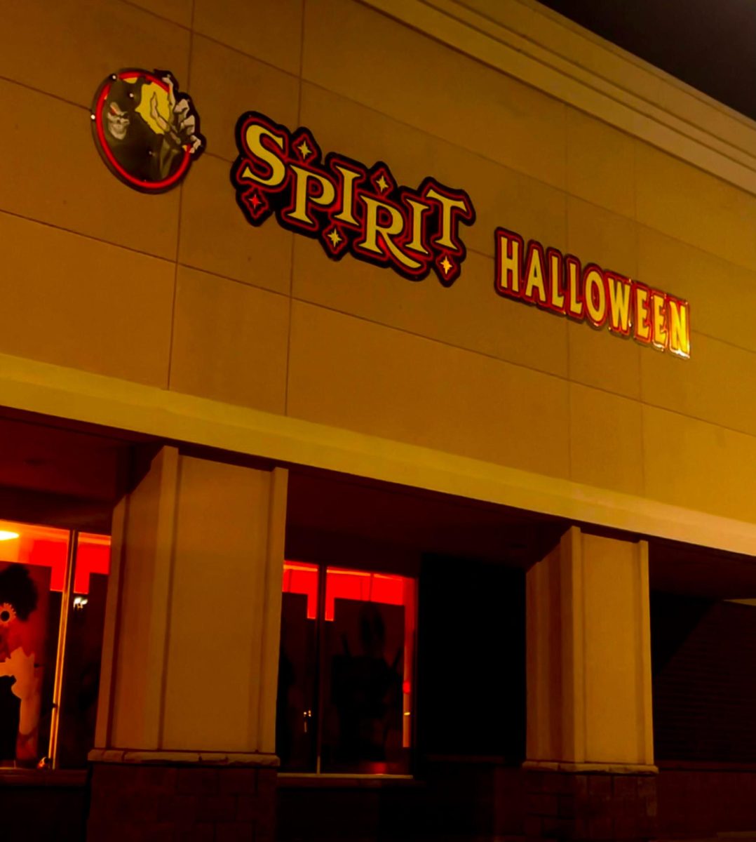 The front of the Spirit Halloween store glows on a gloomy night. A Friday the 13th so close to Halloween is perfect to get you into the ghoulish season. (Ethan Rodriguez | Northern Star) 