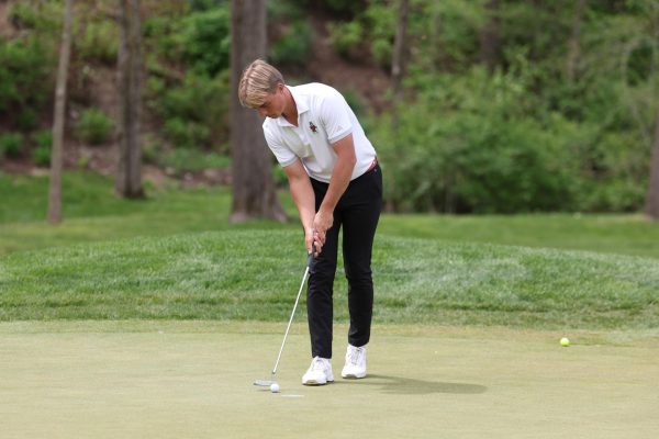 Senior Felix Krammer taps in a putt on the green. Krammer finished in 13th place out of 75 golfers as NIU men's golf finished 13th out of 15 teams. (Courtesy of NIU Athletics)