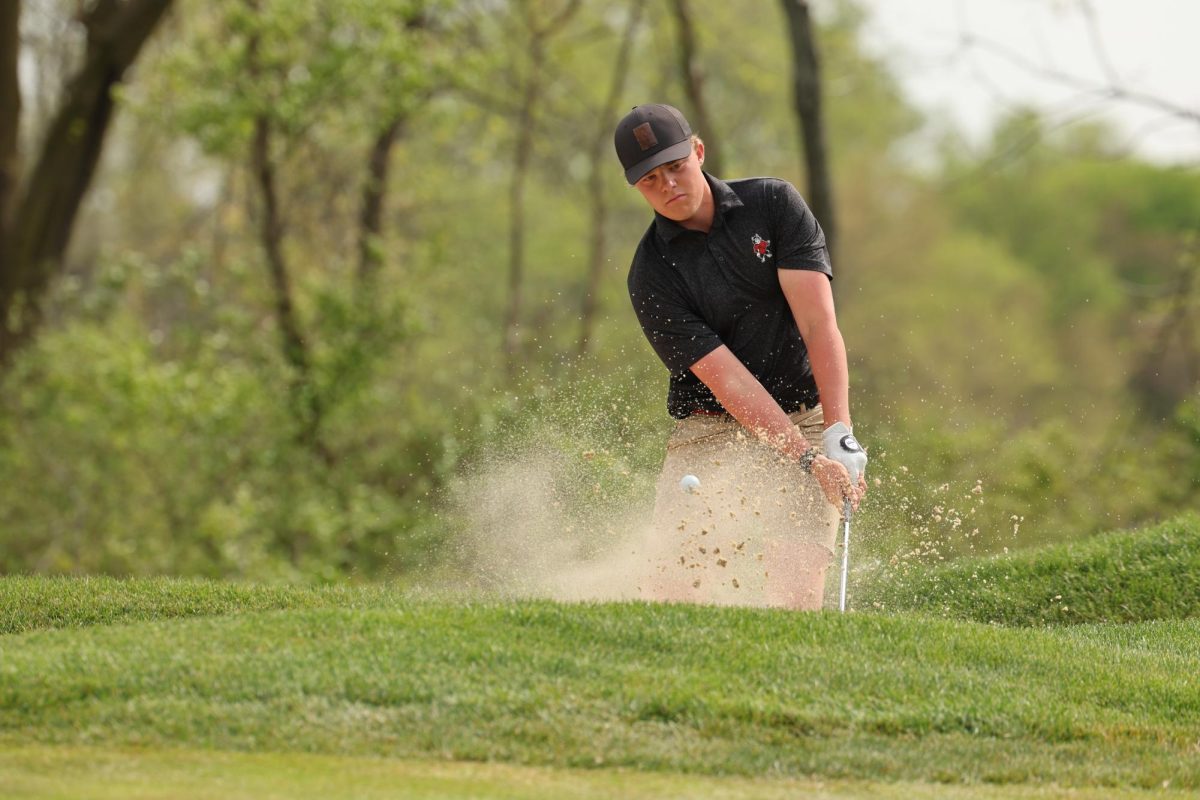 Sophomore Craig Long hits a ball out of a bunker. Long was the top-scoring Huskie golfer as NIU men's golf placed 15th out of 15 teams at the Gopher Invitational. (Courtesy of NIU Athletics)