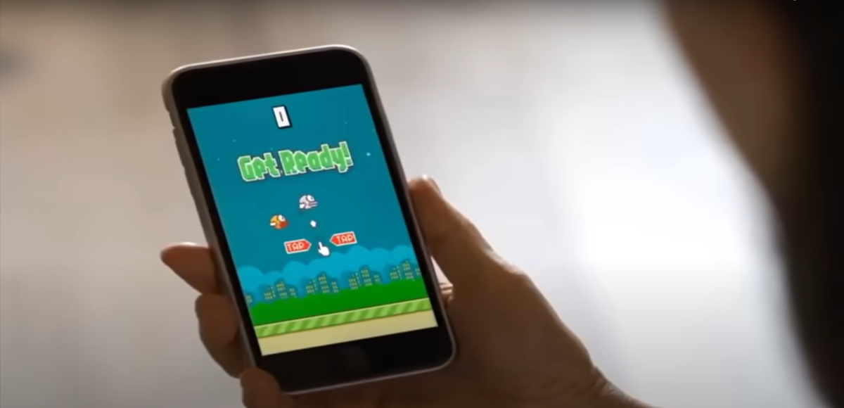 A player prepares to start a round of "Flappy Bird" on their mobile phone. "Flappy Bird" released a trailer detailing its re-release later this year. (IGN under Fair Use)