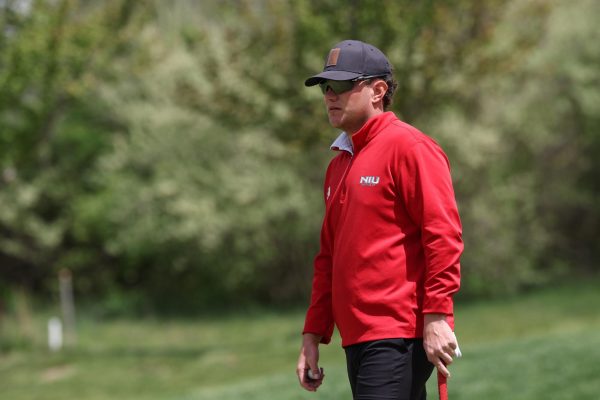 Senior Ben Sluzas stands on the green with a putter in his hand. Assistant Sports Editor Eddie Miller believes underperforming seniors are partially to blame for a last place finish for NIU men's golf on Monday at the Island Resort Intercollegiate. (Courtesy of NIU Athletics)