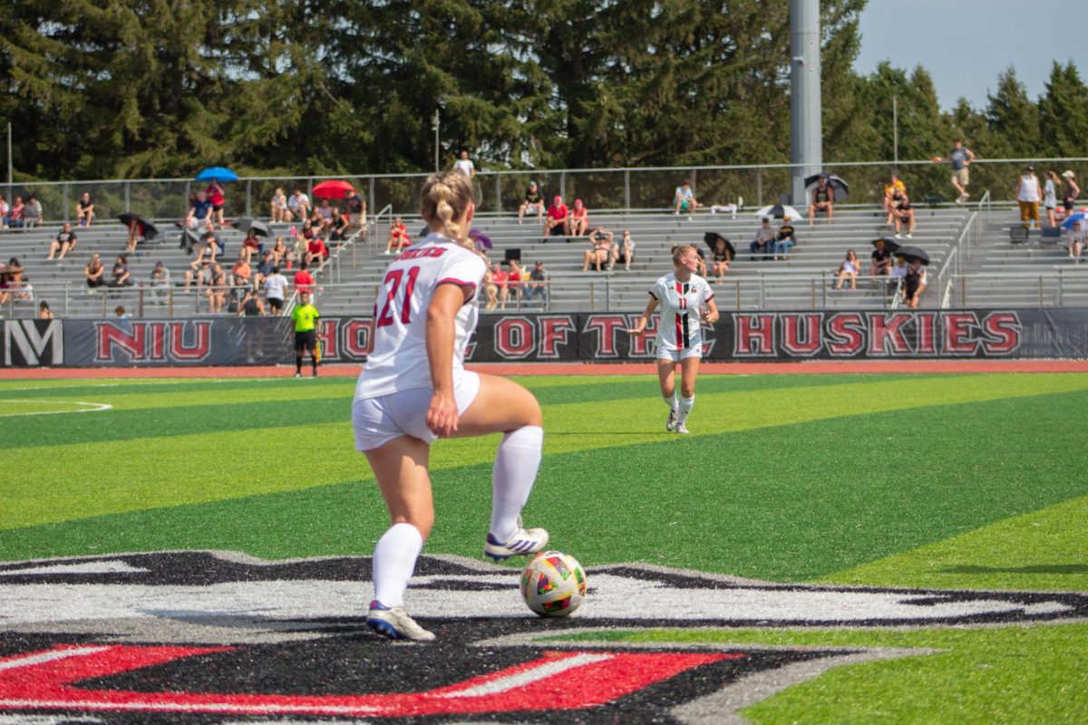 Freshman midfielder Lauren Mrugala (21) looks to pass the ball to senior defender Lea Gruennagel (11) on Sunday at the NIU Soccer and Track & Field Complex. NIU women's soccer tied with Miami University with a score of 1-1 in its first conference game of the season. (Northern Star File Photo)