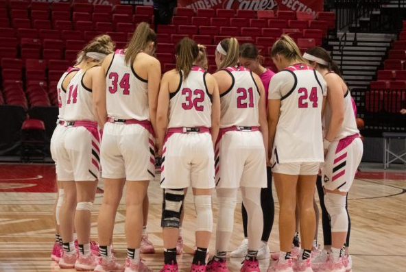 The NIU women's basketball team huddles together on Feb.10 after a win over Georgia Southern University. The 2024-25 women's basketball non-conference schedule was released on Friday. (Northern Star File Photo)