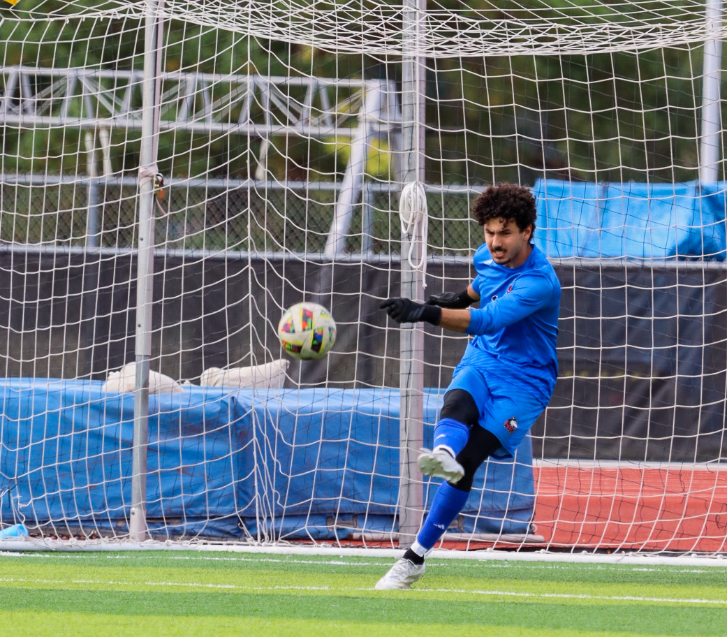 Sophomore goalkeeper Atahan Arslan kicks the ball away from the net on Monday at the NIU Soccer and Track & Field Complex. Arslan had 2 saves in a 1-0 victory for men's soccer over Mercyhurst University. (Marco Alvarez | Northern Star)