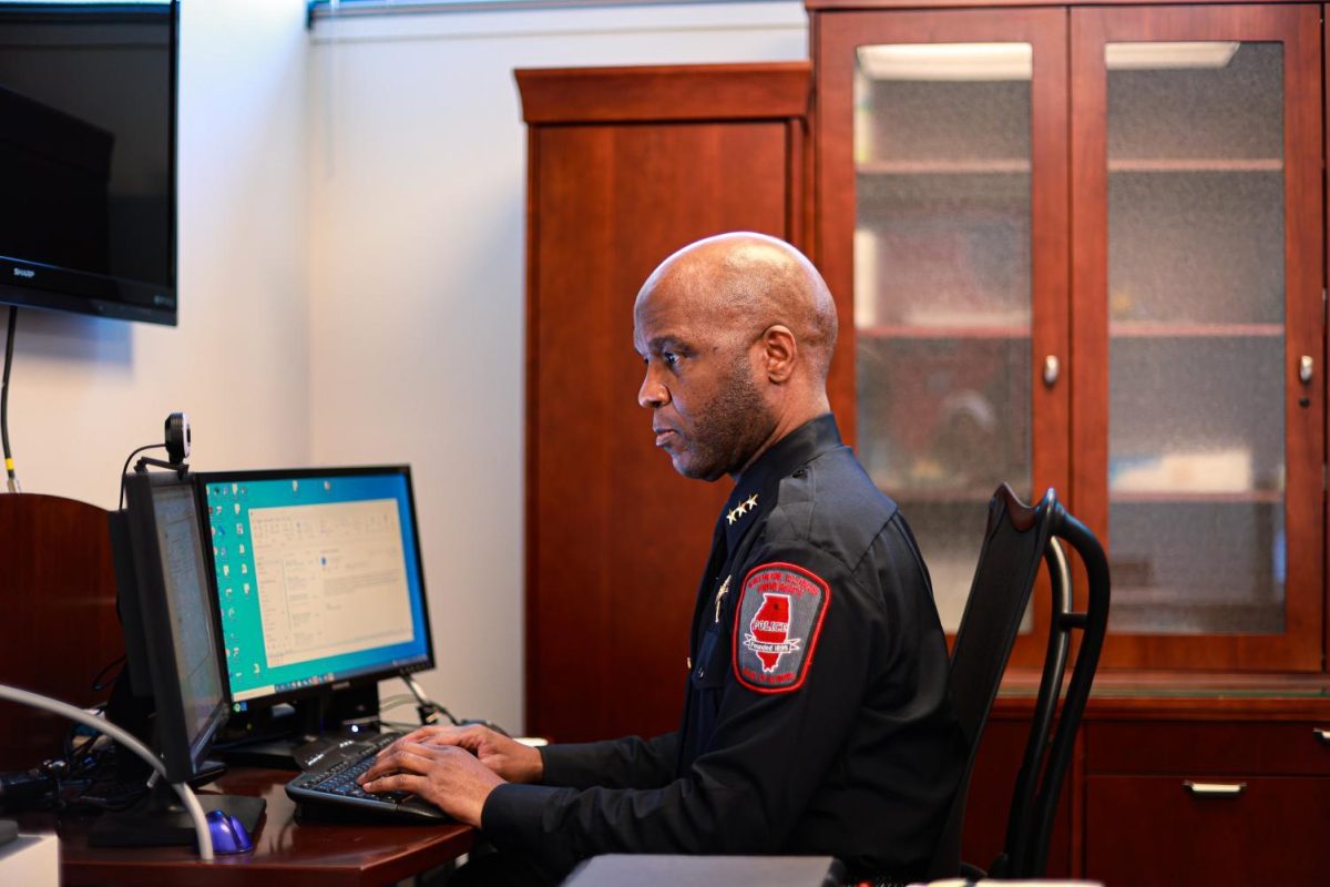 NIU Chief of Police Darren Mitchell types on his computer in his office. The NIU Police Department currently has 41 police officers on staff. (Northern Star File Photo)