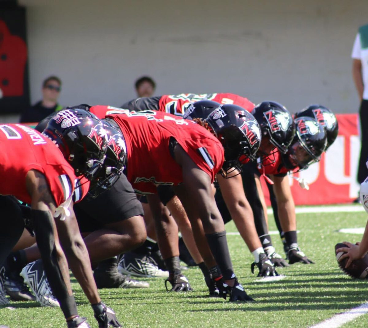 The NIU defensive line lines up opposite of the University of Massachusetts Minutemen offensive line amid the Huskies' 34-20 victory over the Minutemen on Oct. 5. Ahead of the Huskies matchup against Ball State University on Saturday, Ball State Daily News' football beat reporter Kyle Smedley shared his thoughts on the upcoming rivalry game. (Marco Alvarez | Northern Star)