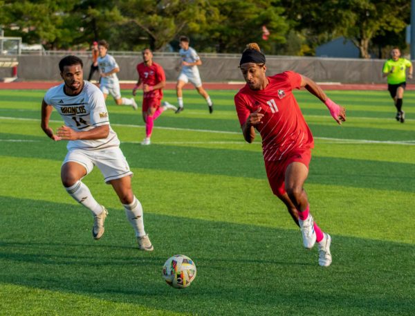 Sophomore forward Sam Divis (11) pushes forward with possession of the ball on Oct. 12 at the NIU Soccer and Track & Field Complex. Divis scored the only goal for NIU men's soccer as the Huskies lost 2-1 to the University of Evansville on Saturday. (Northern Star File Photo)