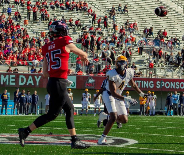 Redshirt freshman quarterback Josh Holst (15) throws a pass on Saturday at Huskie Stadium. Holst passed for 210 yards in his first career start as NIU football lost 13-6 to the University of Toledo Rockets on Saturday. (Totus Tuus Keely | Northern Star)