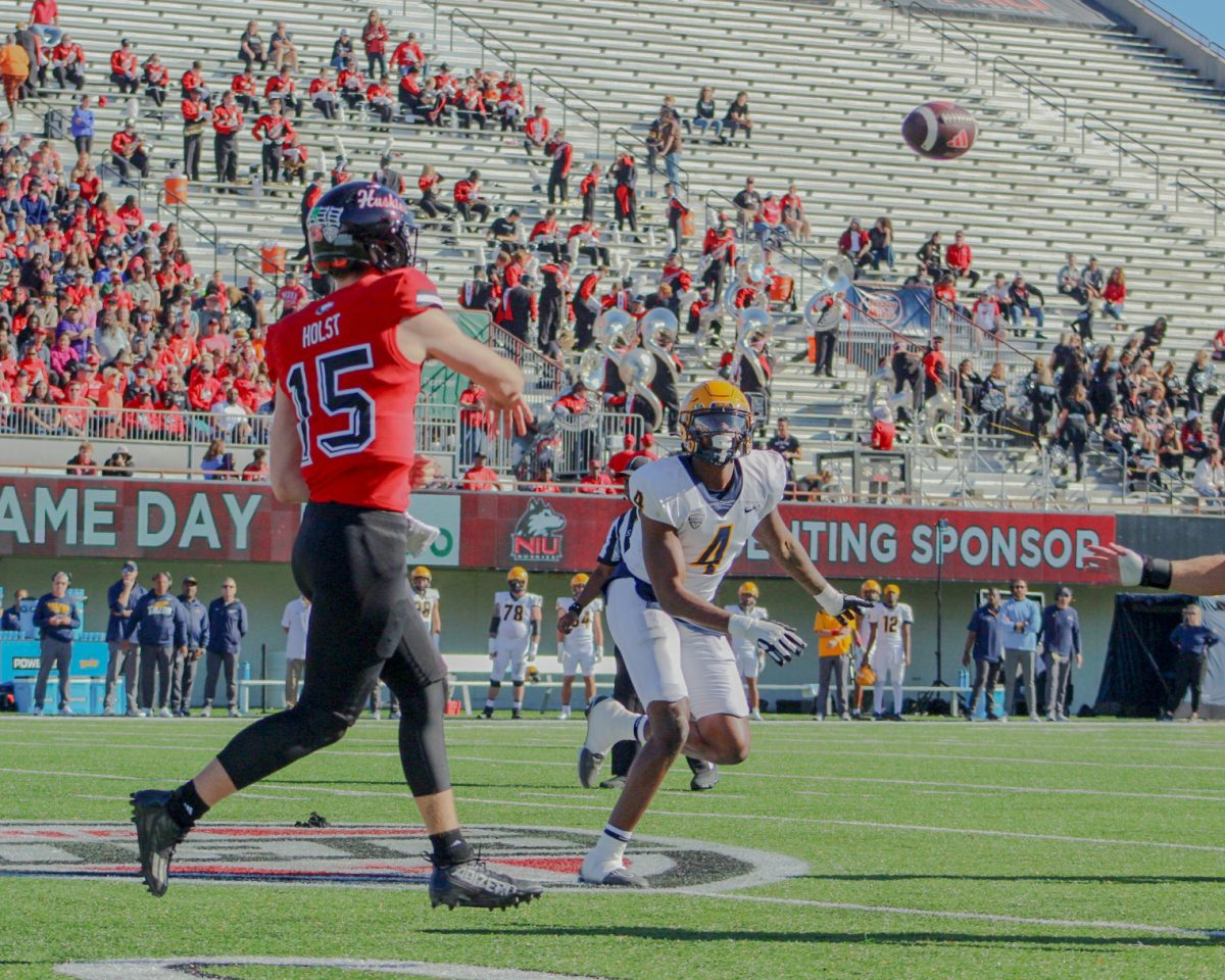 Redshirt freshman quarterback Josh Holst (15) throws a pass on Saturday at Huskie Stadium. Holst passed for 210 yards in his first career start as NIU football lost 13-6 to the University of Toledo Rockets on Saturday. (Totus Tuus Keely | Northern Star)