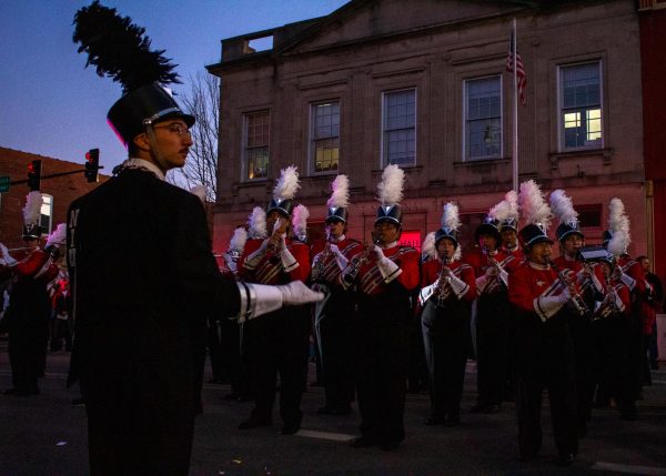 The clarinet section of the NIU Marching Band plays to the time marked by the drum major in front of their section at the Homecoming Block Party event Thursday. The marching band provided music for the entire parade and pep rally. (Totus Tuus Keely | Northern Star)