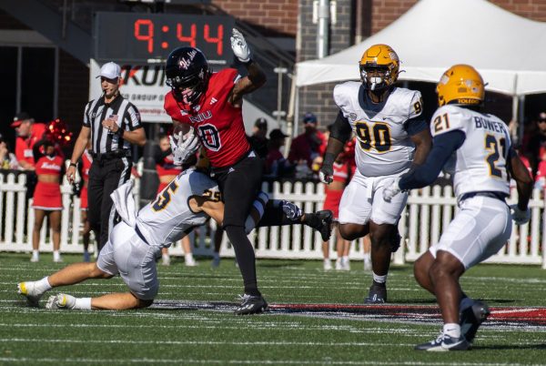 NIU redshirt sophomore wide receiver Cam Thompson (0) runs downfield after catching a 8-yard reception in the first quarter of the 117th Homecoming Game against the University of Toledo on Saturday at Huskie Stadium in DeKalb. Thompson led the Huskies with 80 receiving yards in the game. (Tim Dodge | Northern Star)
