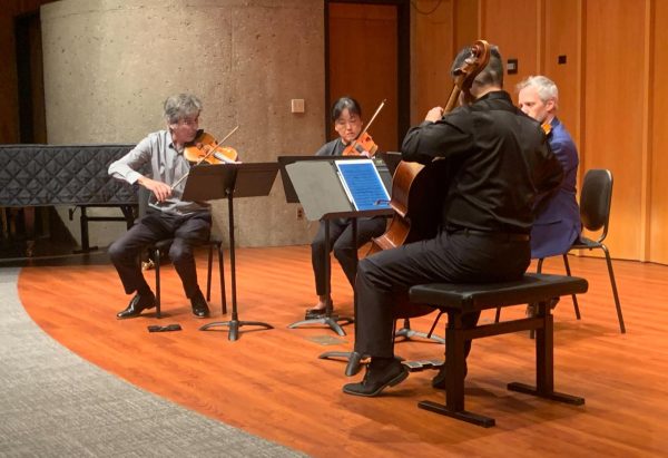 Members of an NIU faculty string quartet play their instruments. The Avalon String Quartet Concert took place Tuesday in the Recital Hall of the Music Building. (Yari Tapia | Northern Star)