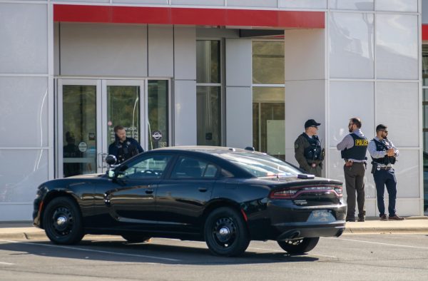 Sycamore and DeKalb police stand outside Brian Bemis Toyota of DeKalb Dealership on Wednesday. At 12:25 p.m., Wednesday, police received a call about a disorderly customer making threats and causing damage. (Tim Dodge | Northern Star)