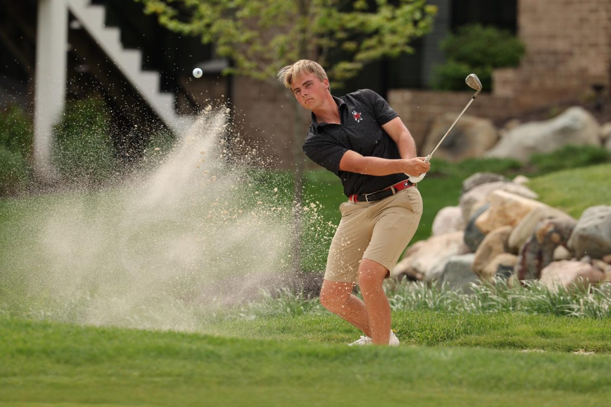 NIU men's golf senior Felix Krammer completes his follow-through while staring down his chip shot. Krammer finished in sixth place at the White Sands Collegiate which wrapped up on Sunday. (Photo courtesy of NIU Athletics) 