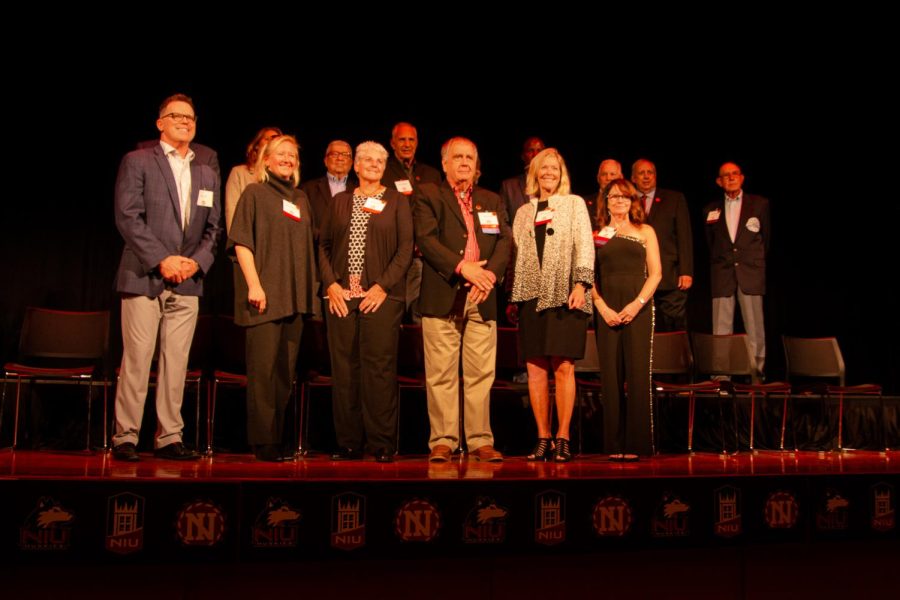 Inductees of the 2022 NIU Athletics Hall of Fame class line the stage at the end of the ceremony on Oct. 7, 2022. NIU Athletics will host a public ceremony for the 2024 Hall of Fame class on Friday. (Northern Star File Photo)