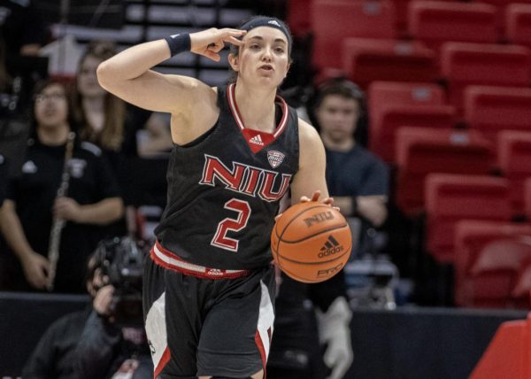 Then-redshirt junior guard Sidney McCrea (2) signals to her teammates as she dribbles the ball up the court against Bowling Green State University on Feb. 24. McCrea led NIU women's basketball in three-point shooting percentage in 2023-24 with 37.6%. (Northern Star File Photo) 
