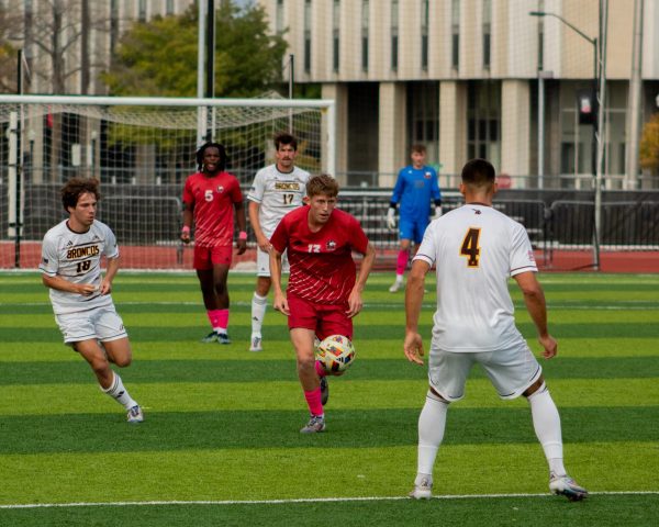 Freshman midfielder Grant Paskus (13) dribbles towards centerfield on Oct. 12 at the NIU Soccer and Track & Field Complex. Paskus scored his first career goal in the 89th minute on Friday as NIU men's soccer won 1-0 against the Belmont University Bruins. (Northern Star File Photo)