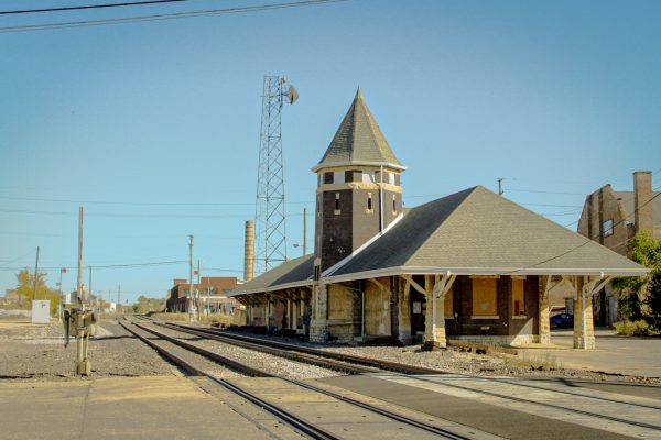 The Union Pacific station between North Sixth and North Seventh Street's railroad crossings sits in desperate need for repair with its boarded up windows and holes through its brick walls. The City of DeKalb expects to hear by the end of the year as to whether or not they can move forward with their plan to bring a Metra train station to DeKalb. (Totus Tuus Keely | Northern Star)