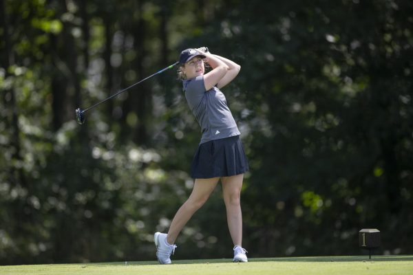 Graduate student Emma Thorman watches her drive during her follow-through from the tee box. Thorman finished tied for 56th place as NIU women's golf finished in 12th place out of 12 teams at the Jim West Challenge on Monday. (Courtesy of NIU Athletics)