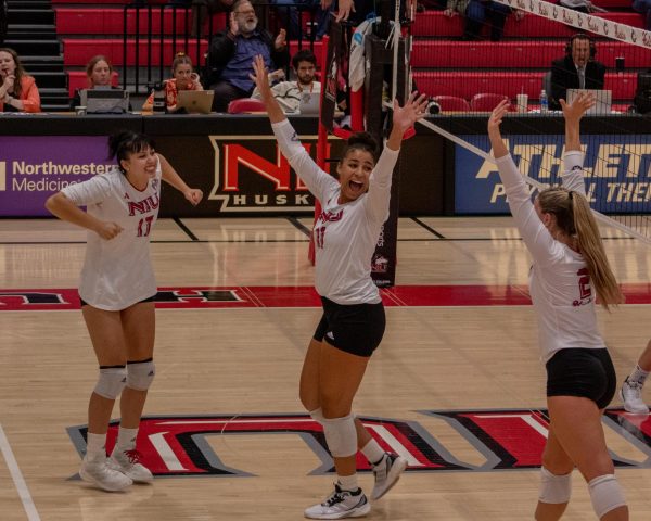 Senior middle blocker Charli Atiemo (11) celebrates after NIU won their last set. NIU volleyball beat Kent State University in just three sets on Thursday. (Totus Tuus Keely | Northern Star)
