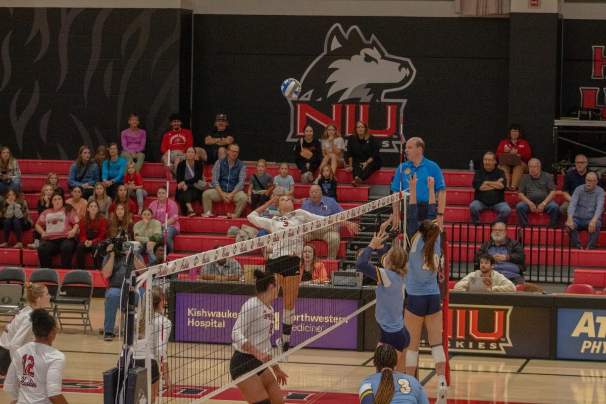 Freshman outside hitter Ava Grevengoed (3) leaps and winds up for a spike on Oct. 10 at Victor E. Court. Grevengoed led the match with 11 kills as NIU volleyball lost in three sets to Western Michigan University on Tuesday. (Northern Star File Photo)