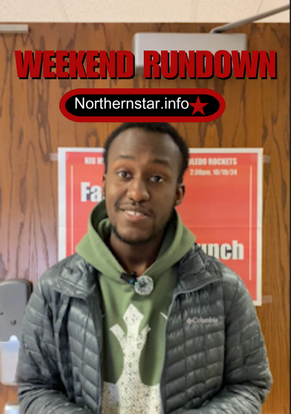 Jonathan Shelby, assistant lifestyle editor, stands in front of the Northern Star's "failure to launch" poster. This weekend is the Homecoming football game, the Divine Nine Rep Yo Step competition and more. (Brynn Krug | Northern Star)