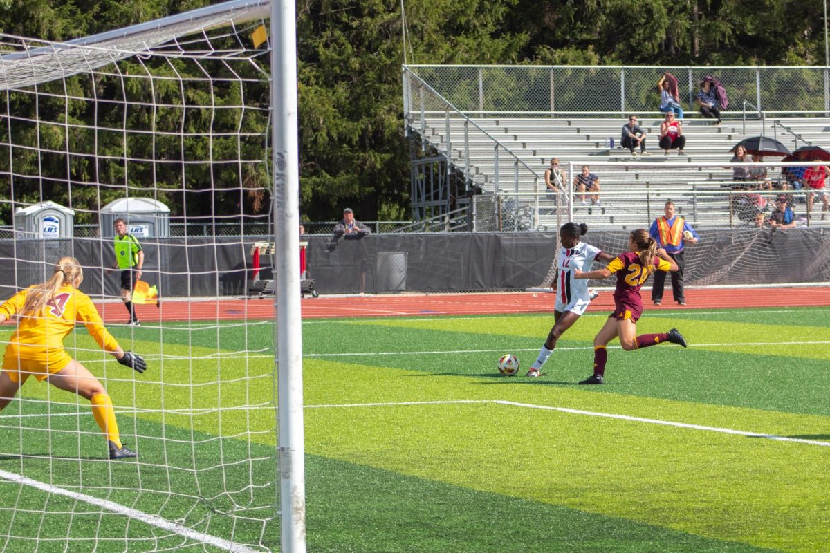 NIU freshman forward Alyssa Stephenson (12) attempts a shot that gets blocked by Central Michigan University junior defender Gabriella Sapia (20). The Huskies are currently 0-3-3 in the MAC after tying with the University of Akron 2-2 on Sunday. (Northern Star File Photo)