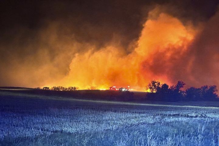 A wildfire blazes Saturday near Arnegard, North Dakota. The increasing rate of wildfires is a steady warning signal that we need swift climate action. (Arnegard Fire Protection District via AP)