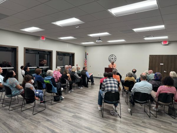 Attendees of the "Eat Your Word" poetry event listen to a speaker. The event was hosted at the DeKalb Country History Center, 1730 N. Main St., Sycamore. (Tyler Gordon | Northern Star)