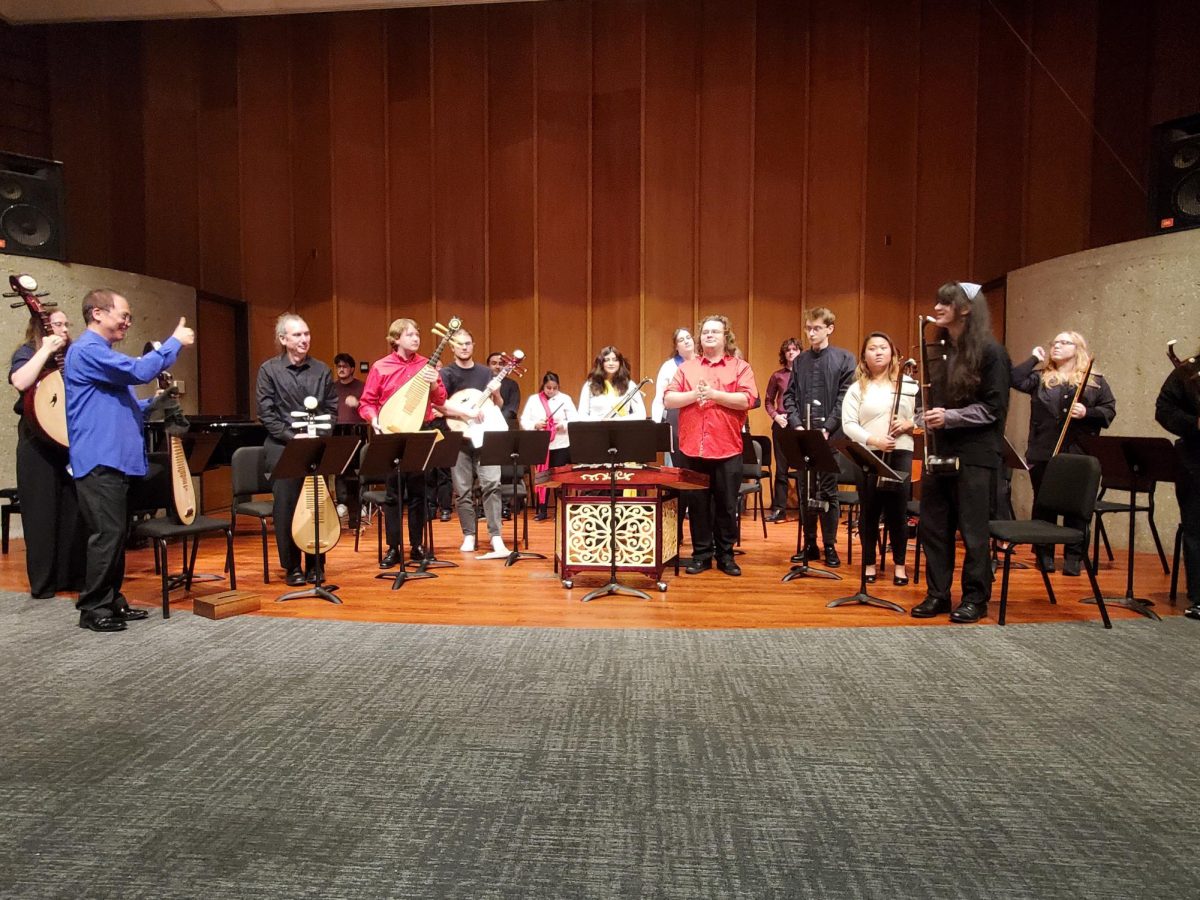 The Chinese Music Ensemble prepares to take a bow after performing the Taiwanese folk song, "Peach Blossom Ferry Crossing." The World Music program performed several pieces of East Asian music in a concert Wednesday. (Jonathan Shelby | Northern Star)