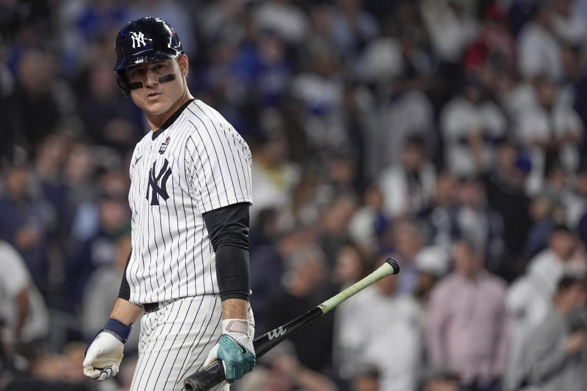 First baseman Anthony Rizzo walks back to the dugout after striking out to end the eighth inning in Game 5 of the baseball World Series on Oct. 30 in New York. Sports Editor Lucas Didier believes Rizzo is one free agent that should be signed by the Chicago Cubs this offseason. (Godofredo A. Vásquez | AP Photo)