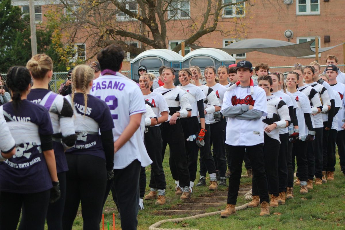 The Alpha Sigma Alpha tugs team -- coached by Sigma Nu -- stares down Sigma Sigma Sigma -- coached by Delta Chi -- ahead of the final rope of the Women's Tugs Chapionship. ASA defeated Tri Sigma in two ropes. (Ro Hong | Northern Star) 