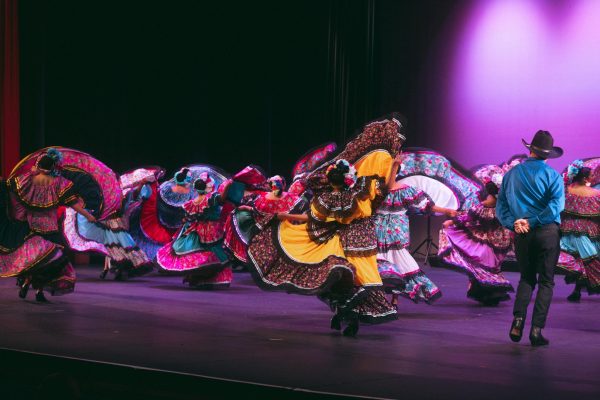 The Ballet Folklórico Aztlán dance team spins on stage. The group aims to expresses traditional Mexican culture through dance. (Courtesy of Alyssa Calderón)