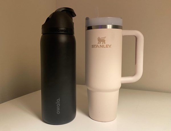 An Owala and Stanley water bottle sit next to each other. These popular water bottles each have their pros and cons. (Brynn Krug | Northern Star)