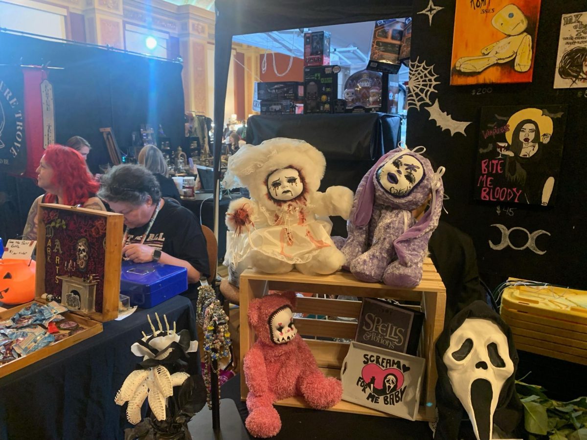 Plush toys with creepy doll faces sit on a table. The Dark Art and Oddities Con took place in Altgeld Hall. (Yari Tapia | Northern Star)